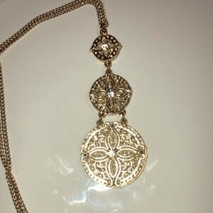 Long gold tone necklace with adjustable chain
